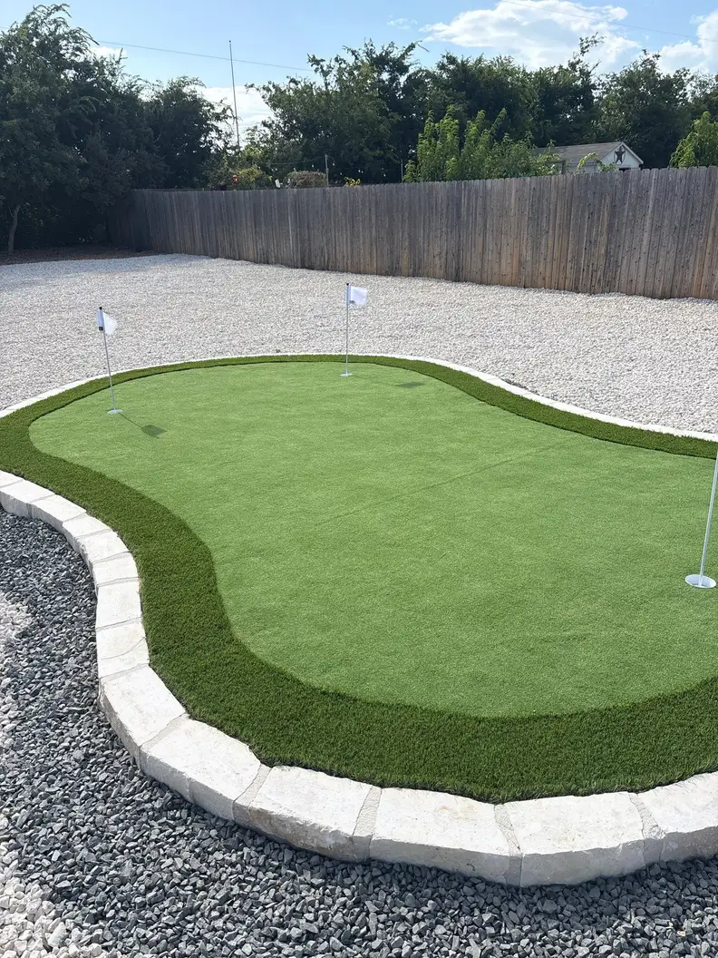 Custom putting green edged in cut limestone block at The Reserve at Copper Canyon