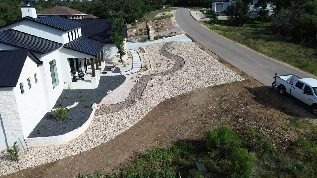 Aerial view of a decomposed granite path winding through a gravel and native planting scheme