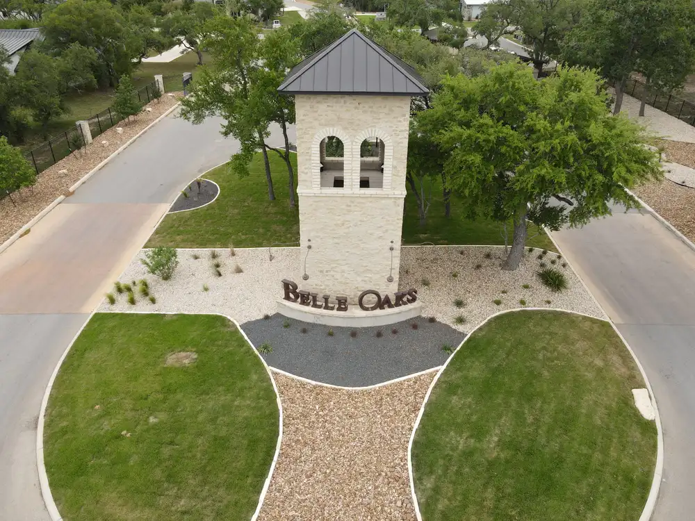 Aerial view of the Belle Oaks entry monument with granite paths radiating out through planted beds