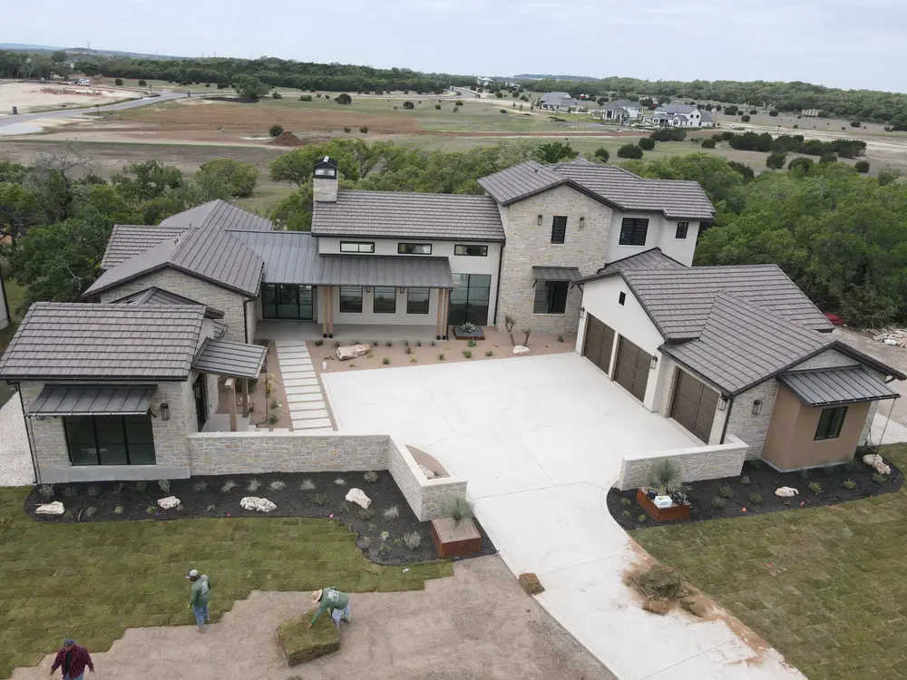 A Brad Moore custom home during installation, with the lot still bare graded dirt