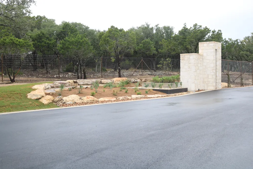 The approach road at Canyon Crossing with the monument and new planting beds